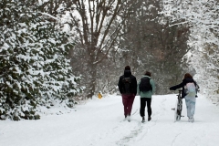 Kids walk path in snow