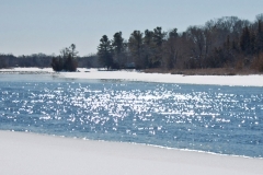 River glinting in snow and ice